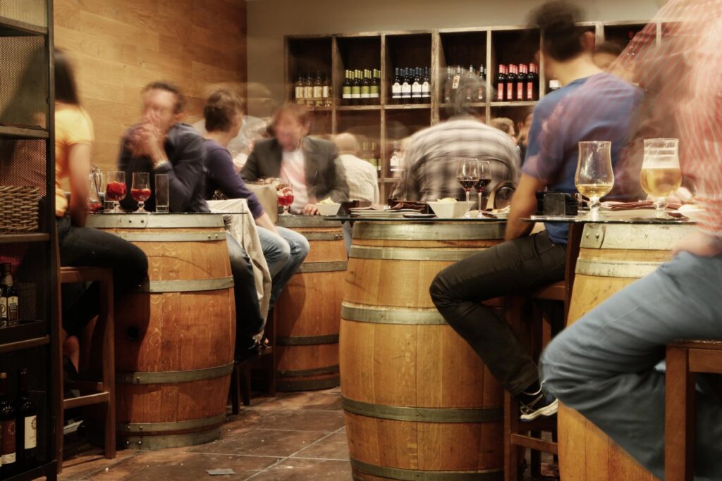 Group of people having a wine and prosecco tasting tour, which is quite popular in Venice.